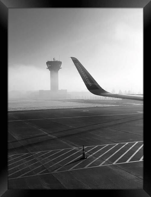 Foggy airport runway in b&w Framed Print by Camilo Diaz