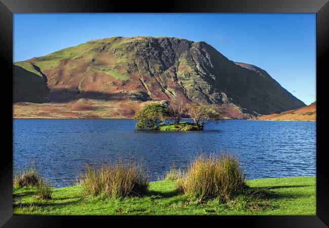 Sunlit autumnal colours at Crummock Water Framed Print by Ian Duffield