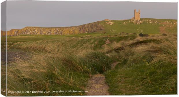 Dunstanburgh Castle Sunset Cliffs Canvas Print by Alan Dunnett