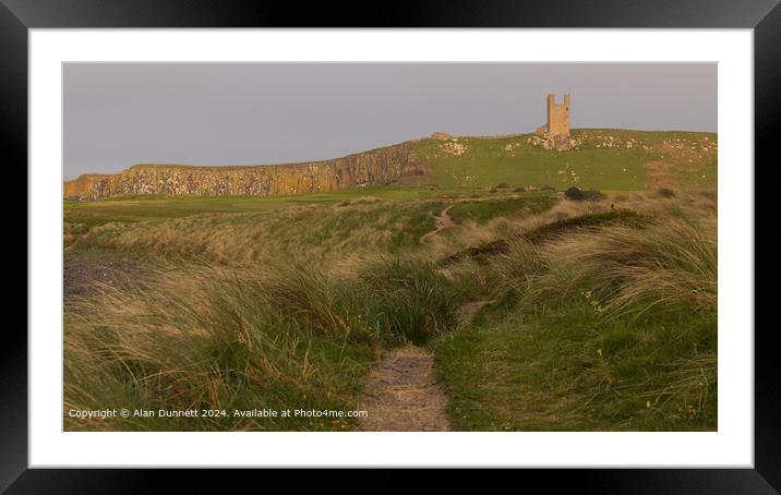 Dunstanburgh Castle Sunset Cliffs Framed Mounted Print by Alan Dunnett