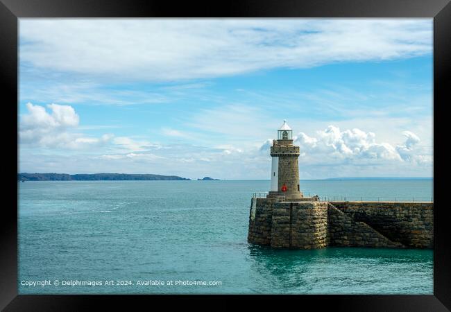 Castle Breakwater lighthouse in St Peter Port, Guernsey, Channel Islands Framed Print by Delphimages Art