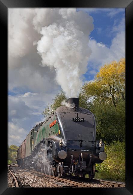 Powerful steam locomotive approaching at speed Framed Print by Ian Duffield