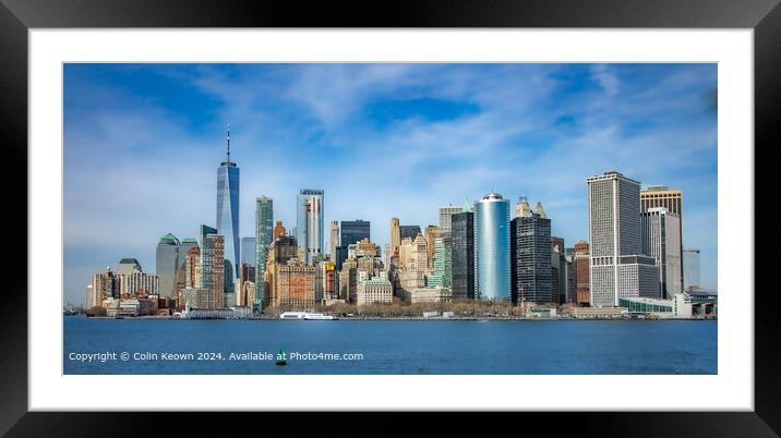 A striking capture of the New York Financial District skyline, taken from the Staten Island Ferry. Framed Mounted Print by Colin Keown