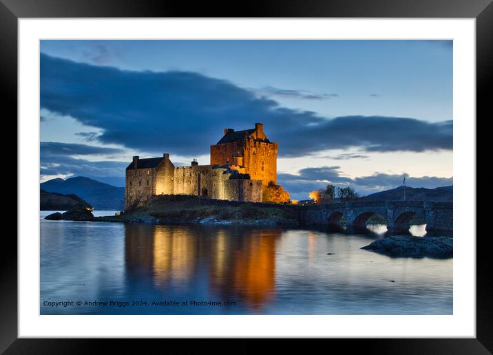 Eilean Donan Castle night shot in the Highlands of Scotland Framed Mounted Print by Andrew Briggs