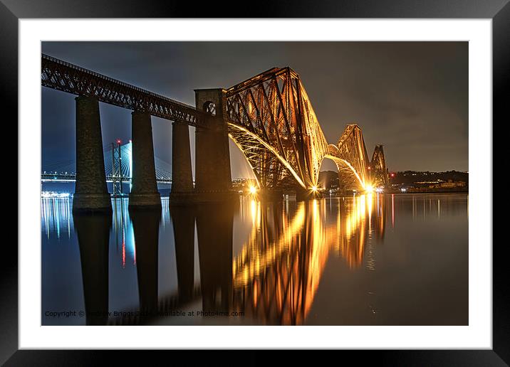 The illuminated Forth Bridge at night. Framed Mounted Print by Andrew Briggs