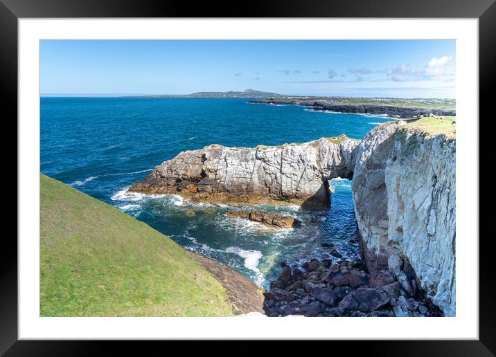 The white arch and sea thrift Anglesey  Framed Mounted Print by Gail Johnson