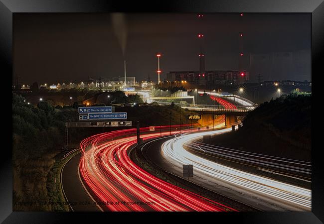 Ferrybridge light trails on the A1M in the north of England Framed Print by Andrew Briggs