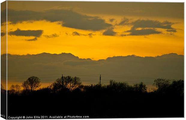 Sunset over Woolsington Canvas Print by John Ellis