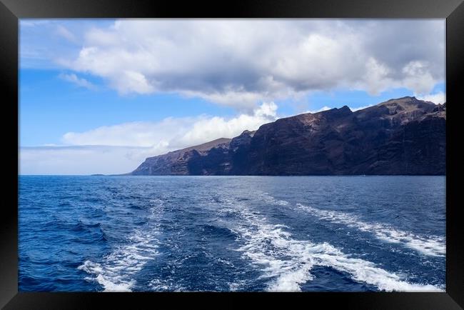View of the mighty cliffs of Los Gigantes on Tenerife from the water side. Framed Print by Michael Piepgras