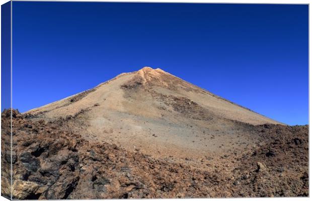 View of the impressive Mount Theide on Tenerife in its rocky surroundings. Canvas Print by Michael Piepgras