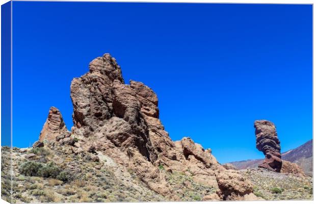 The majestic Roques de Garcia rocks on Tenerife on a beautiful sunny day. Canvas Print by Michael Piepgras