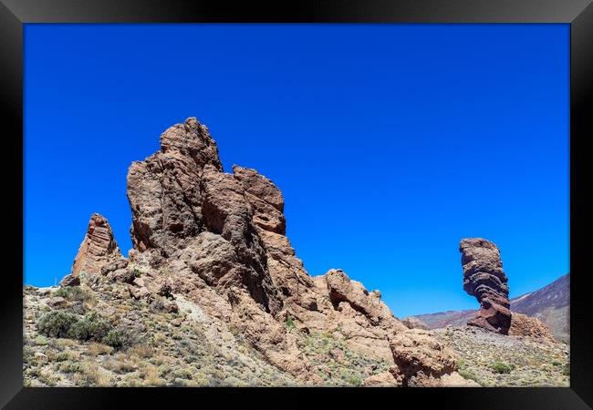 The majestic Roques de Garcia rocks on Tenerife on a beautiful sunny day. Framed Print by Michael Piepgras