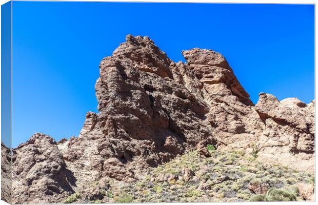 The majestic Roques de Garcia rocks on Tenerife on a beautiful sunny day. Canvas Print by Michael Piepgras