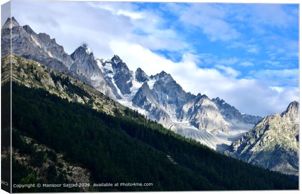 the greenery with the raw stoney mountains covered with snow Canvas Print by Mansoor Sajjad