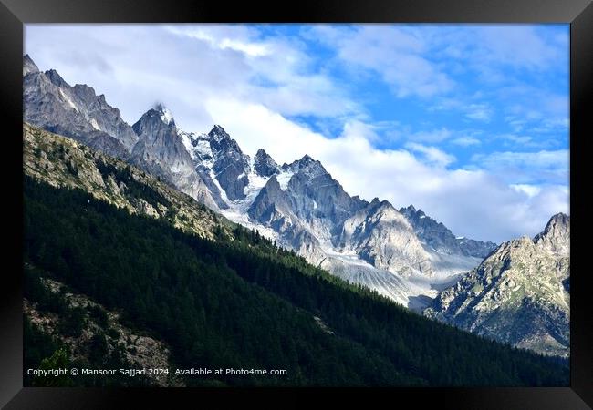 the greenery with the raw stoney mountains covered with snow Framed Print by Mansoor Sajjad