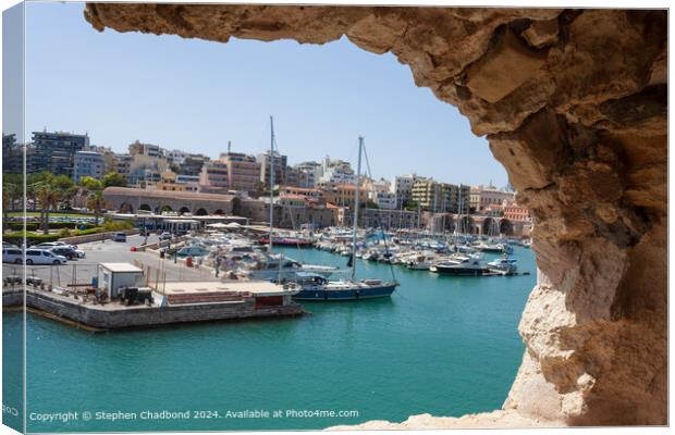 picturesque port viewed from an arch in the old fort at Heraklion Canvas Print by Stephen Chadbond