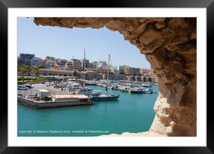 picturesque port viewed from an arch in the old fort at Heraklion Framed Mounted Print by Stephen Chadbond