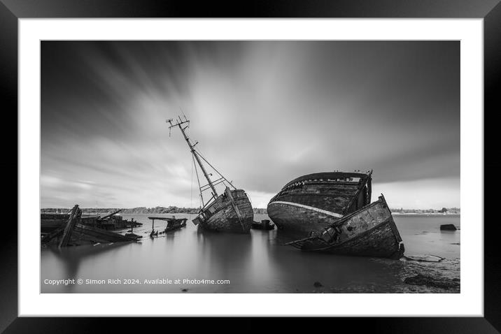 Black and white image of Pin Mill wrecks  Framed Mounted Print by Simon Rich