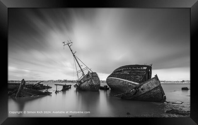 Black and white image of Pin Mill wrecks  Framed Print by Simon Rich