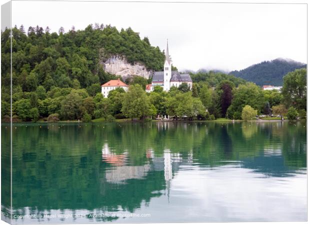 Shows St Martin's Church on the shore of Lake Bled Canvas Print by Hazel Wright
