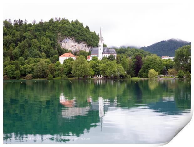 Shows St Martin's Church on the shore of Lake Bled Print by Hazel Wright