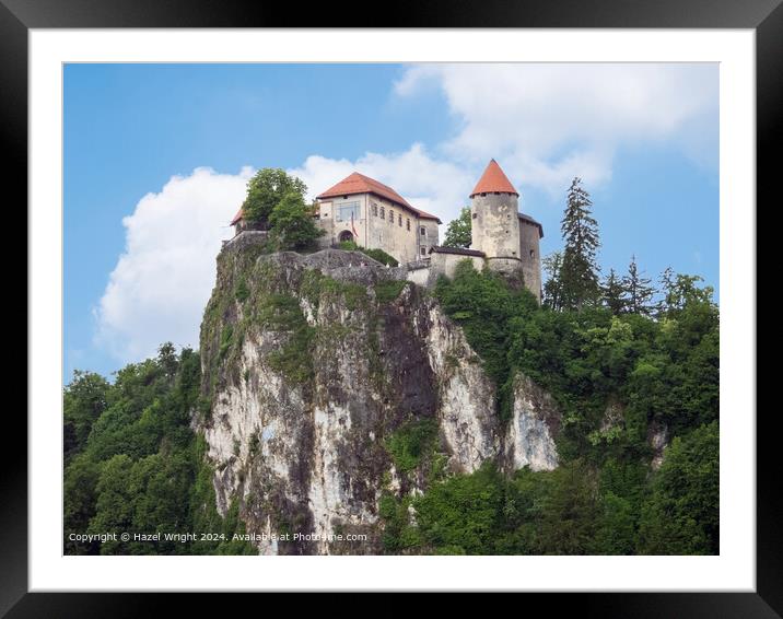 Imposing castle towering over Lake Bled, Slovenia Framed Mounted Print by Hazel Wright