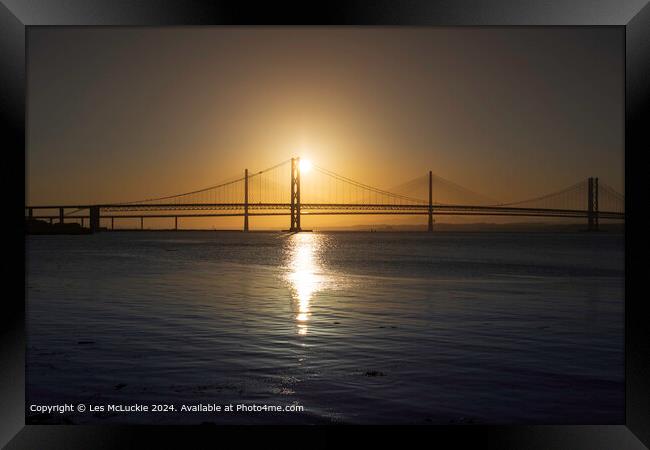 View of the Forth road bridges at sunset Framed Print by Les McLuckie