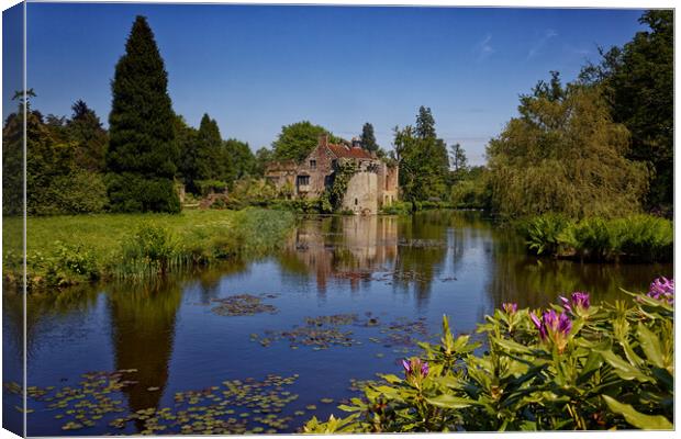 Reflections of the folly in the moat of Old Scotney Castle Lamberhurst Kent UK Canvas Print by John Gilham