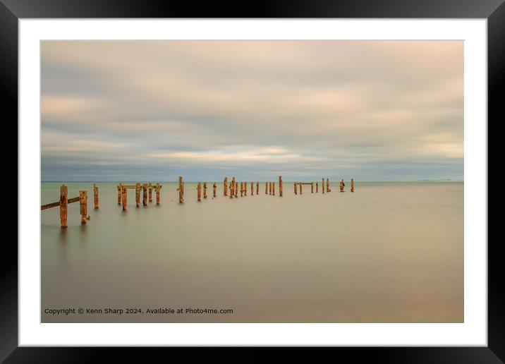 A fine art slow shutter tranquil seascape with old weathered wooden pier posts Framed Mounted Print by Kenn Sharp