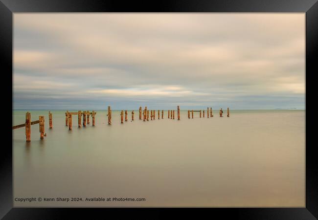 A fine art slow shutter tranquil seascape with old weathered wooden pier posts Framed Print by Kenn Sharp