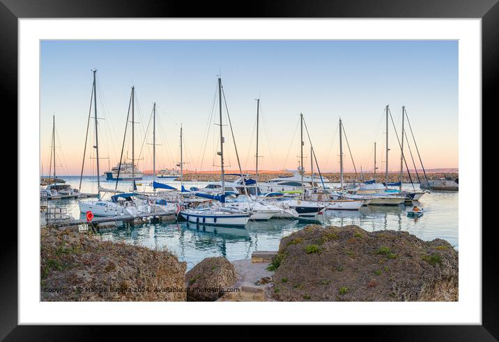 Sunset with Boats and Ferries at Mgarr Harbour, Gozo, Malta. Framed Mounted Print by Maggie Bajada
