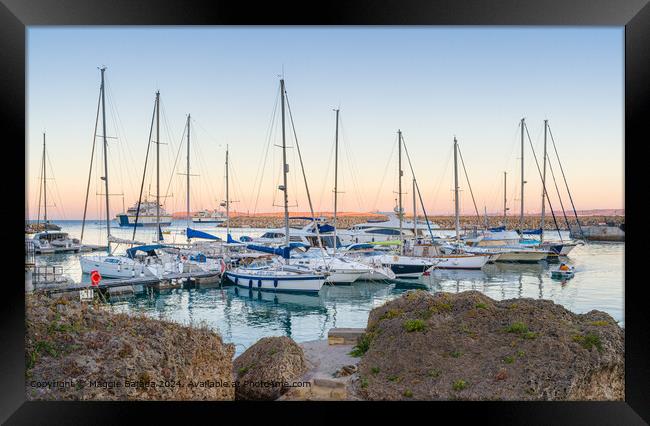 Sunset with Boats and Ferries at Mgarr Harbour, Gozo, Malta. Framed Print by Maggie Bajada