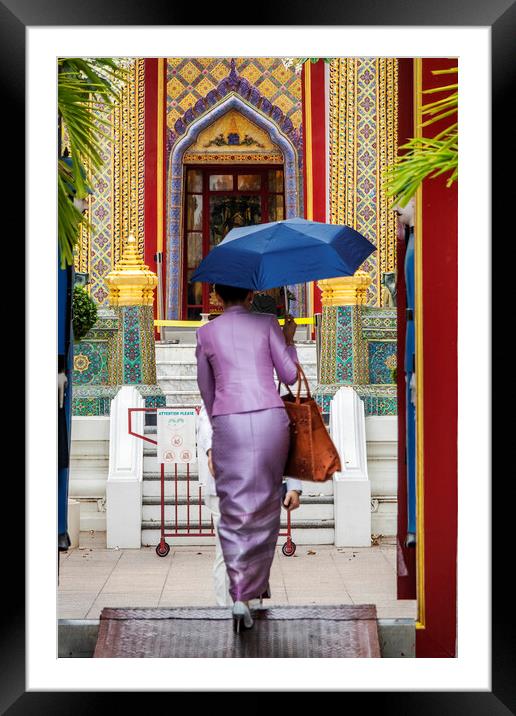 Thai Woman with Umbrella at Wat Ratchabophit Framed Mounted Print by Kevin Hellon