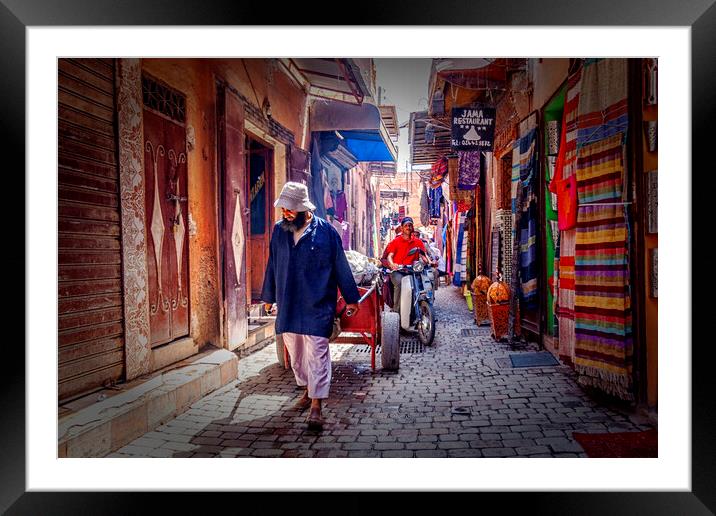 Marrakesh Man Pulling Cart Framed Mounted Print by Kevin Hellon