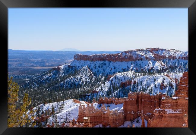Snow-Capped Landscape of Bryce Canyon National Park During Winter Framed Print by Madeleine Deaton