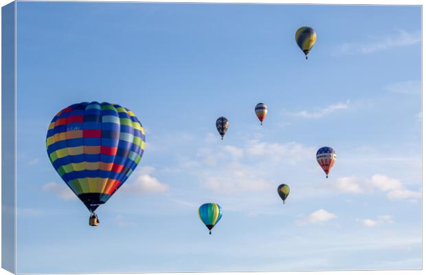 Colourful Hot Air Balloon Ascending Canvas Print by J Biggadike