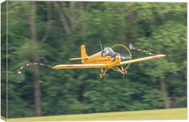 Turbulent Flying Aircraft in Forest Canvas Print by J Biggadike