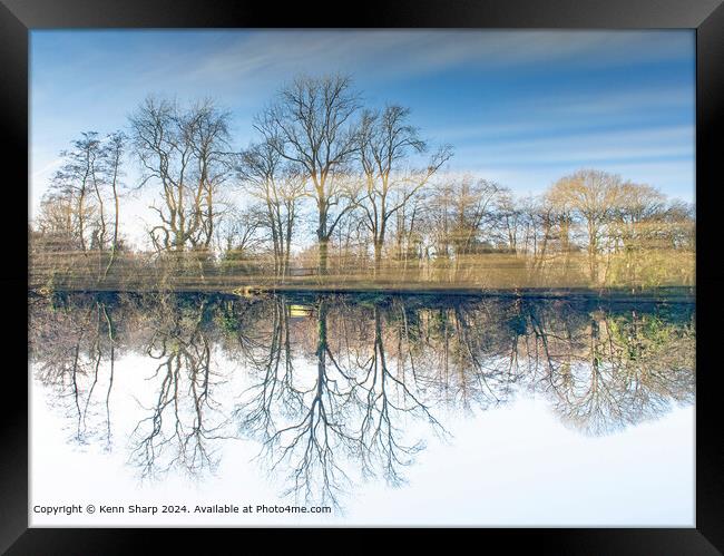 Lakeside reflection with a twist Framed Print by Kenn Sharp