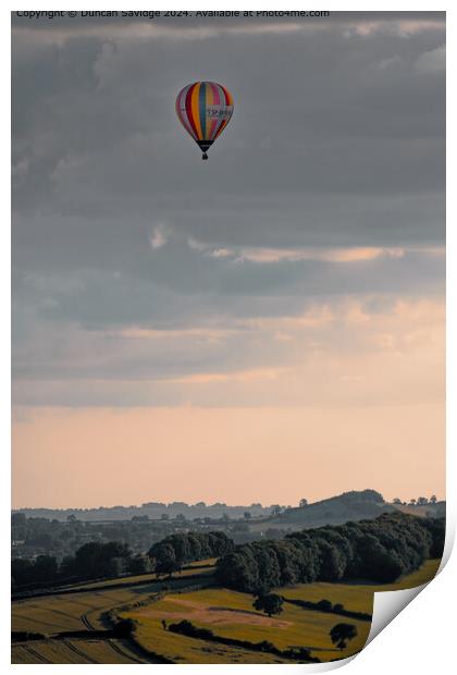 Somerset hot air balloon in a moody sky Print by Duncan Savidge