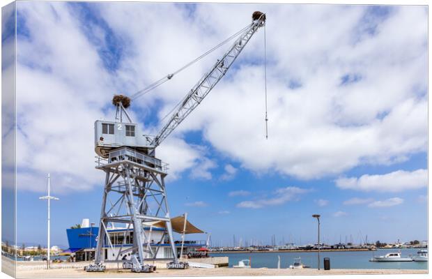 Old port crane at Portimao harbour Canvas Print by Jim Monk