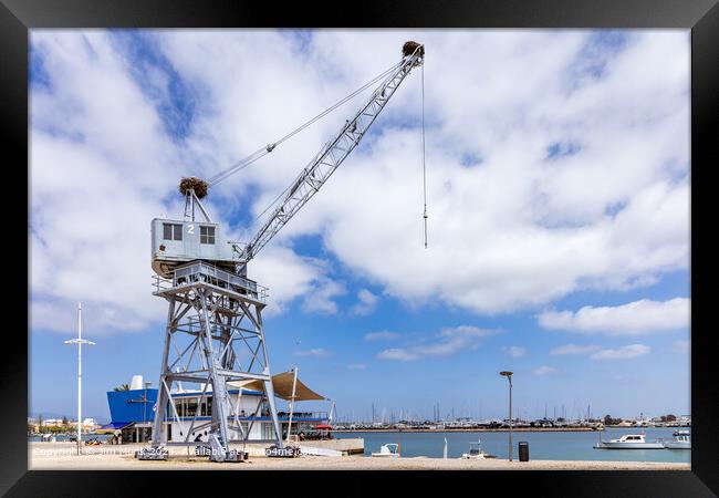 Old port crane at Portimao harbour Framed Print by Jim Monk