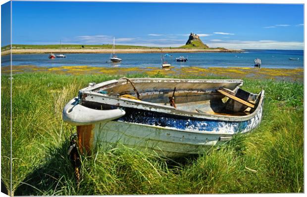 Lindisfarne Castle and Boat Canvas Print by Darren Galpin