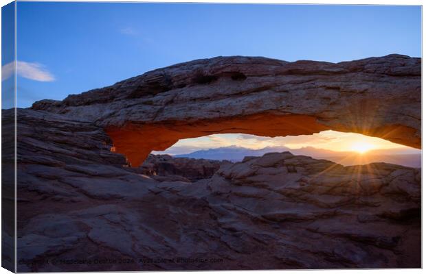 Spectacular Sunrise with Lens Flare at Mesa Arch in Canyonlands National Park, Utah Canvas Print by Madeleine Deaton