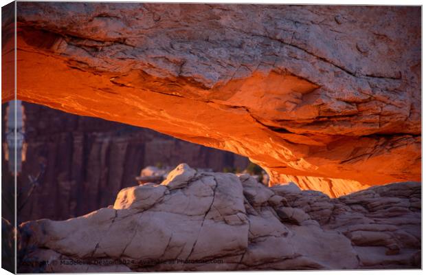 Sunrise Glow on the Under Side of Mesa Arch in Canyonlands National Park Canvas Print by Madeleine Deaton