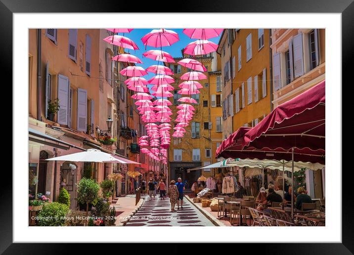 Pink umbrellas in old town Grasse, French Riviera Framed Mounted Print by Angus McComiskey