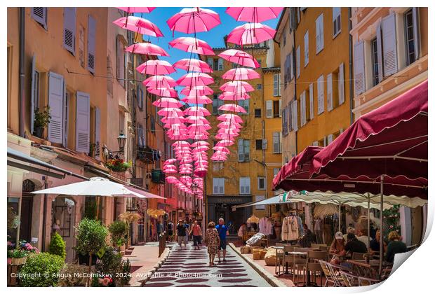 Pink umbrellas in old town Grasse, French Riviera Print by Angus McComiskey
