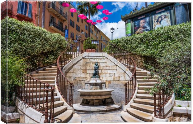 Water fountain in old town Grasse, French Riviera Canvas Print by Angus McComiskey