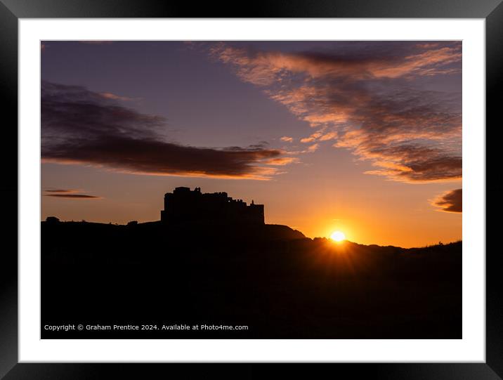 Bamburgh Castle Sunset Silhouette at Sunset Framed Mounted Print by Graham Prentice