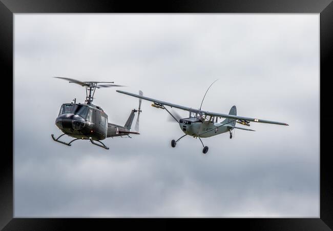 Cessna O-1 Bird Dog and Bell UH-1 Huey Helicopter Framed Print by J Biggadike