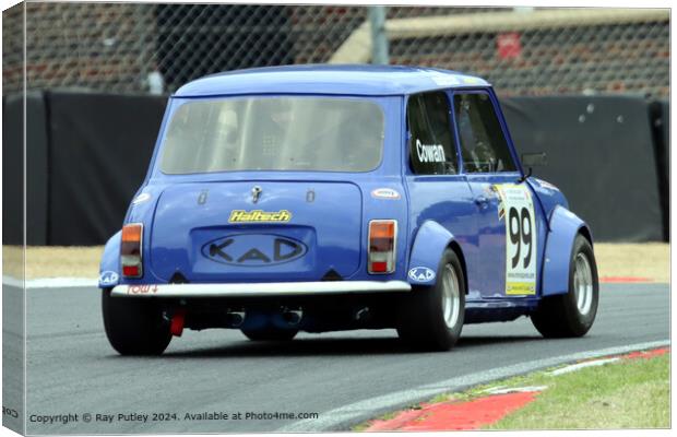 Blue Mini Racing: Dynamic, Thrilling, Action Canvas Print by Ray Putley